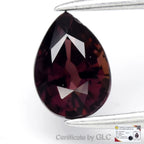 GLC Certified 0.88ct VVS Pear Natural Reddish Purple Sapphire with black facet borders and visible GL certificate text.