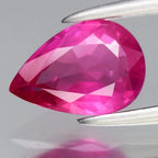 CERTIFICATE incl. 0.78ct pear-shaped pink sapphire gemstone with faceted edges, Mozambique origin, on display stand.