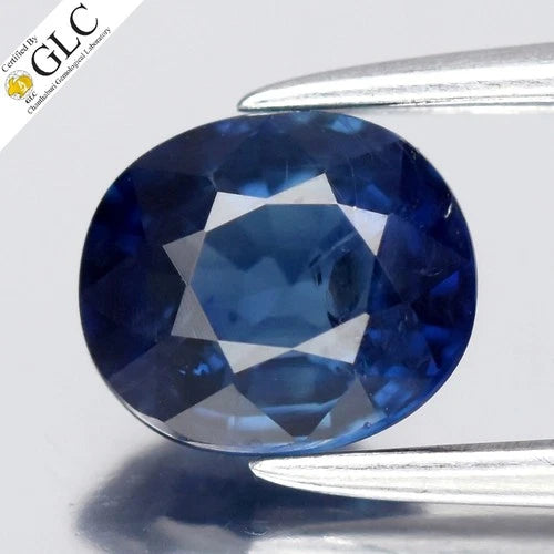 0.87ct oval natural blue sapphire with hexagonal shape, heated in Africa, certified by GLC in white lab report.