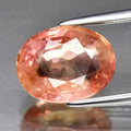 CERTIFICATE Incl.* 3.10ct Oval Pinkish Orange Sapphire (Heated Glass Filling)