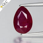 1.39ct pear-shaped ruby with pinkish red center, heated in lab, certificate by GLC in clear holder.