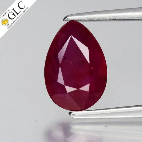 1.39ct pear-shaped ruby with pinkish red center, heated in lab, certificate by GLC in clear holder.