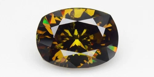 4.97ct VS cushion brilliant natural yellowish green demantoid garnet with black facets on white background.