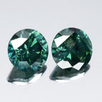 Pair 2p/1.92ct Round Brilliant Natural Treated Fancy Bluish Green Diamond SI1
